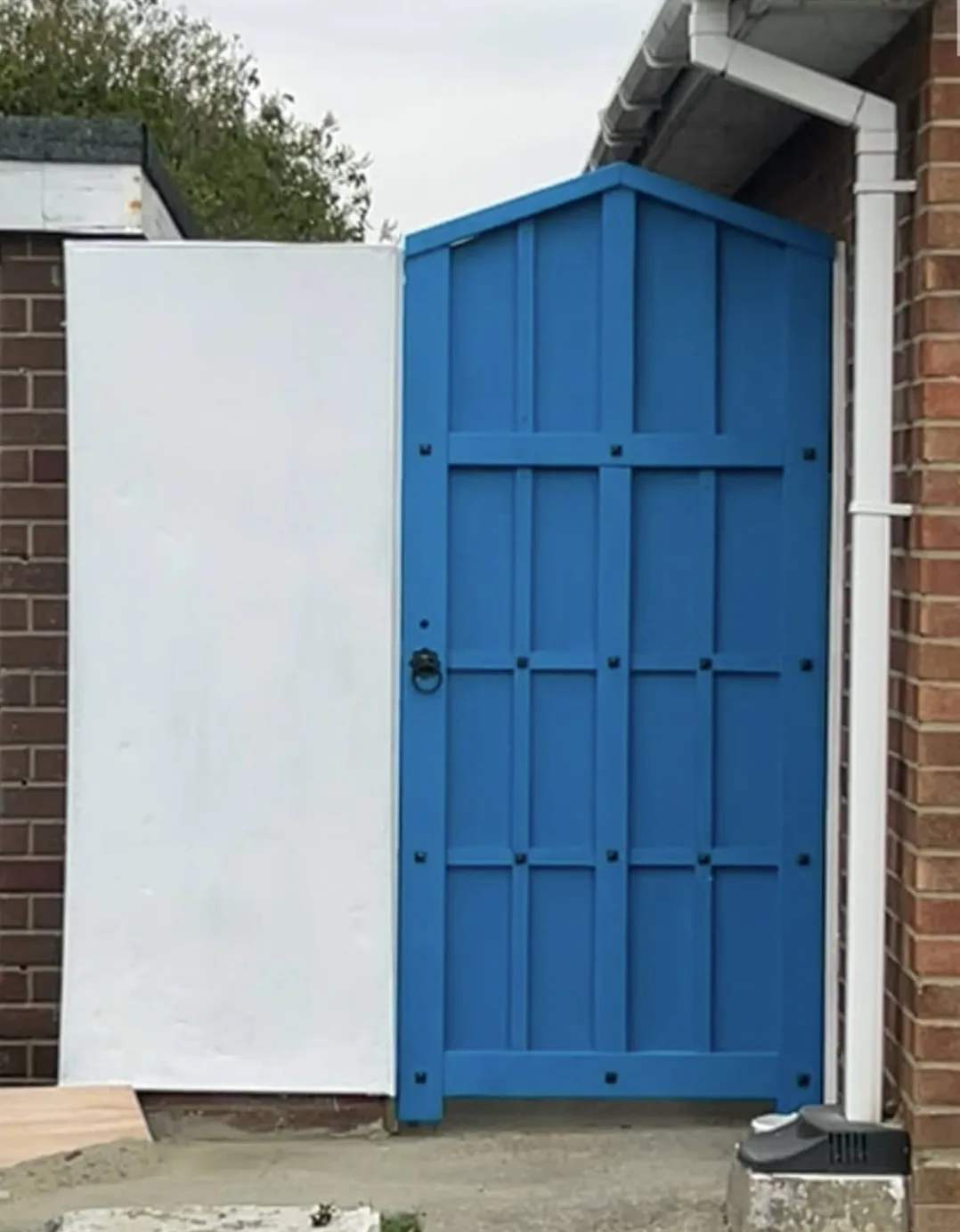 After: completed blue bespoke garden gate rebuilt to match the original design