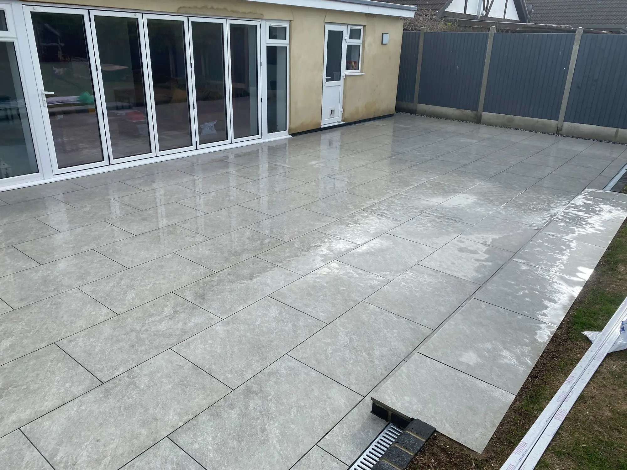 Completed indoor and outdoor grey porcelain tiling project