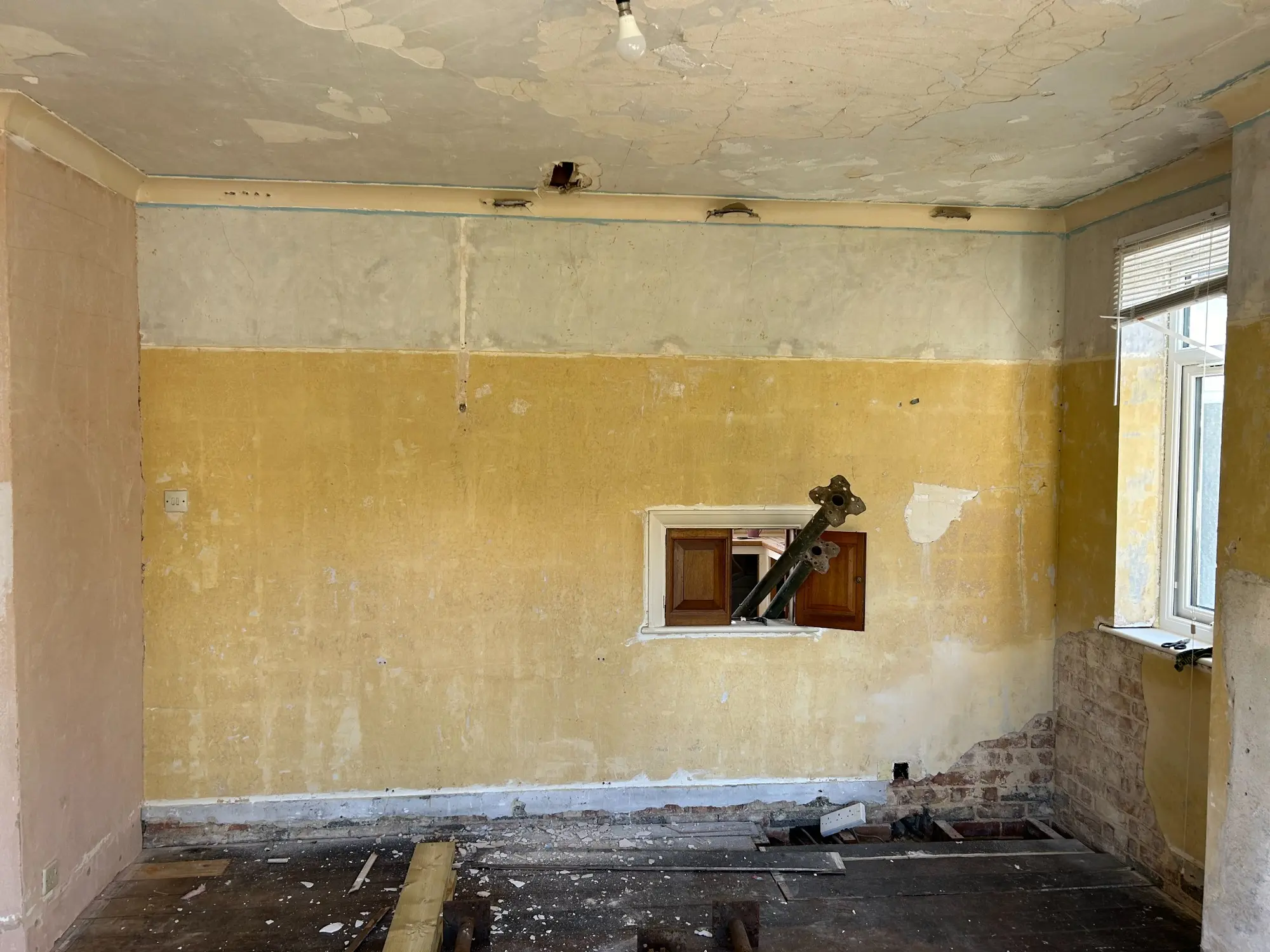 Original dividing wall before the kitchen and dining room knock-through